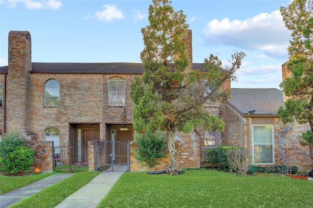 8718 Maplecrest Dr, Houston, TX 77099 - multi unit property with a gate, roof with shingles, brick siding, and a chimney