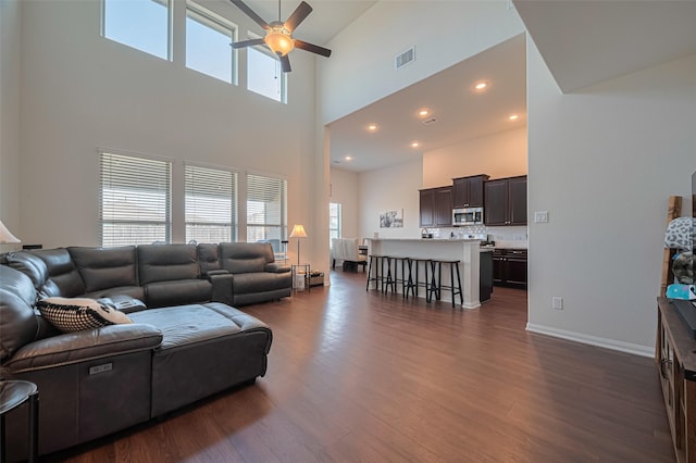 308 Morning Dove Trl, Sealy, TX 77474 - living room with a towering ceiling, ceiling fan, and dark wood finished floors
