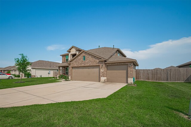 308 Morning Dove Trl, Sealy, TX 77474 - traditional-style home with brick siding, concrete driveway, a garage, and roof with shingles