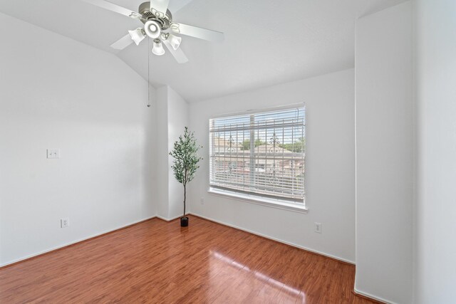 13911 Fraser Lake Ln, Houston, TX 77083 - empty room with wood finished floors, vaulted ceiling, and a ceiling fan