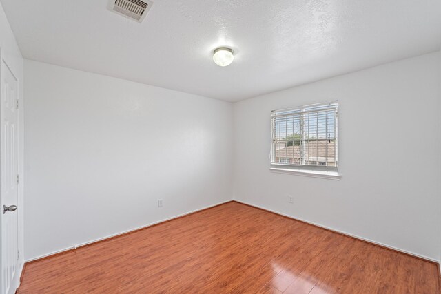 13911 Fraser Lake Ln, Houston, TX 77083 - unfurnished room with wood finished floors
