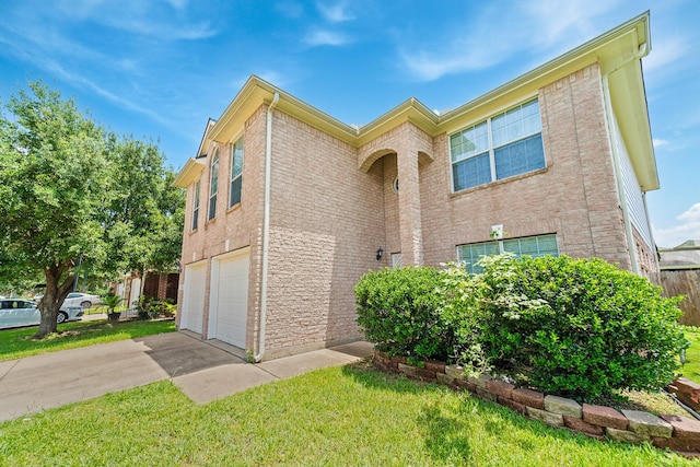 13911 Fraser Lake Ln, Houston, TX 77083 - view of front of house featuring an attached garage, a front lawn, driveway, and brick siding