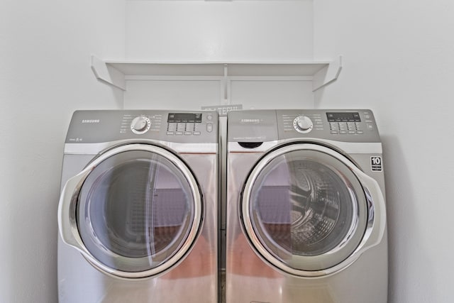 13911 Fraser Lake Ln, Houston, TX 77083 - laundry area with washer and clothes dryer