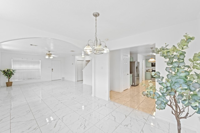 13911 Fraser Lake Ln, Houston, TX 77083 - spare room with arched walkways, ceiling fan, stairway, and light marble finish floors