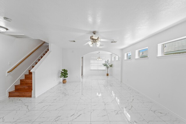 13911 Fraser Lake Ln, Houston, TX 77083 - hall with arched walkways, stairway, light marble finish flooring, and baseboards
