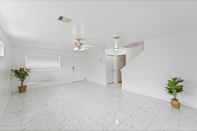 13911 Fraser Lake Ln, Houston, TX 77083 - unfurnished room featuring baseboards, light marble finish flooring, and ceiling fan
