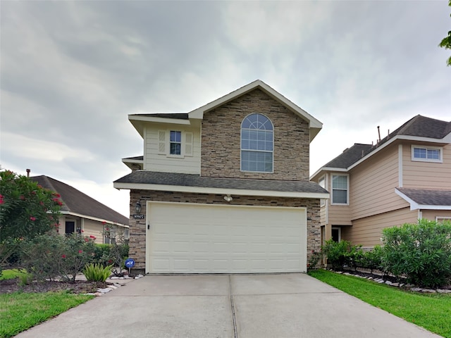 10807 Tobar Falls Cir, Houston, TX 77064 - traditional-style house featuring an attached garage, concrete driveway, and stone siding