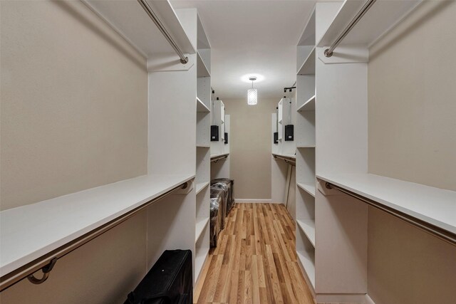 1327 Tiki Dr, Tiki Island, TX 77554 - walk in closet featuring light wood-style floors