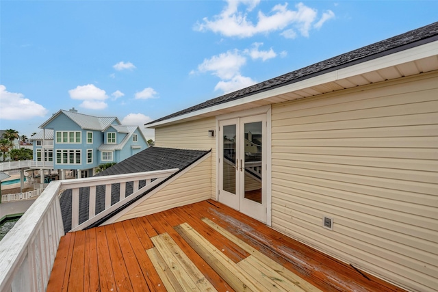 1327 Tiki Dr, Tiki Island, TX 77554 - wooden deck featuring french doors