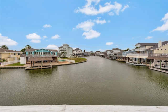 1327 Tiki Dr, Tiki Island, TX 77554 - dock featuring a residential view and a water view