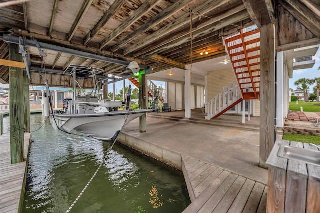 1327 Tiki Dr, Tiki Island, TX 77554 - dock area featuring a water view and stairs