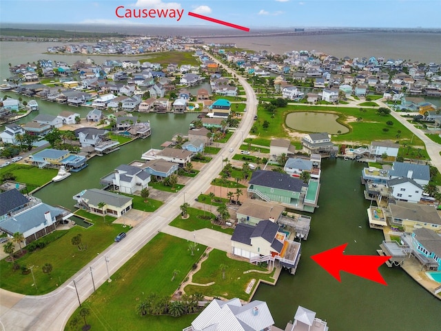 1327 Tiki Dr, Tiki Island, TX 77554 - aerial view of residential area featuring a large body of water