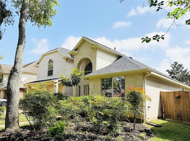 3218 Oak Cliff Ln, Missouri City, TX 77459 - view of front facade with brick siding and roof with shingles
