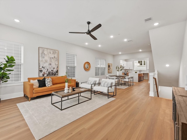 3516 Piney Woods Dr, Houston, TX 77018 - living room with light wood-style floors, a ceiling fan, recessed lighting, and baseboards