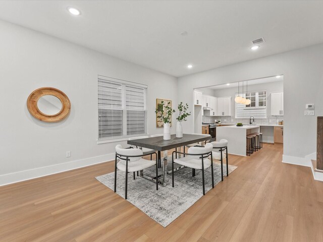 3516 Piney Woods Dr, Houston, TX 77018 - dining space featuring baseboards, light wood finished floors, and recessed lighting