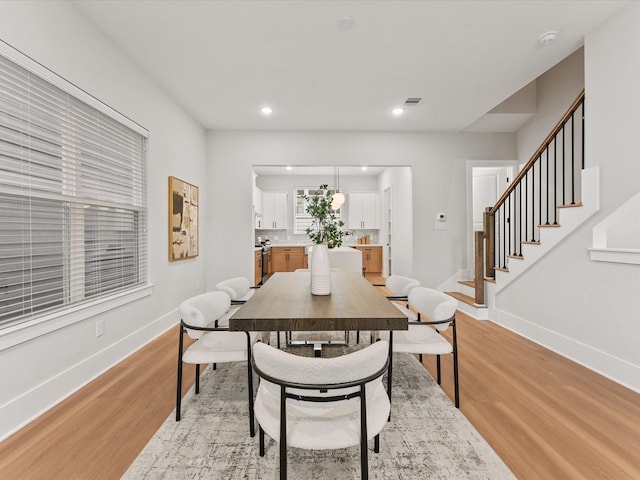 3516 Piney Woods Dr, Houston, TX 77018 - dining room featuring light wood-style flooring, baseboards, stairs, and recessed lighting
