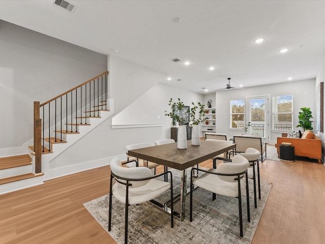 3516 Piney Woods Dr, Houston, TX 77018 - dining space featuring light wood-style floors, stairway, baseboards, recessed lighting, and a ceiling fan