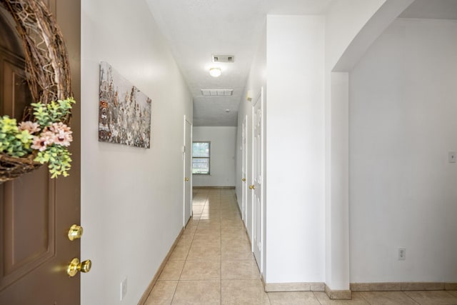 3102 Spring Flower Ln, Spring, TX 77388 - hall featuring light tile patterned floors and baseboards