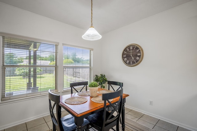 3102 Spring Flower Ln, Spring, TX 77388 - dining room featuring light tile patterned flooring and baseboards