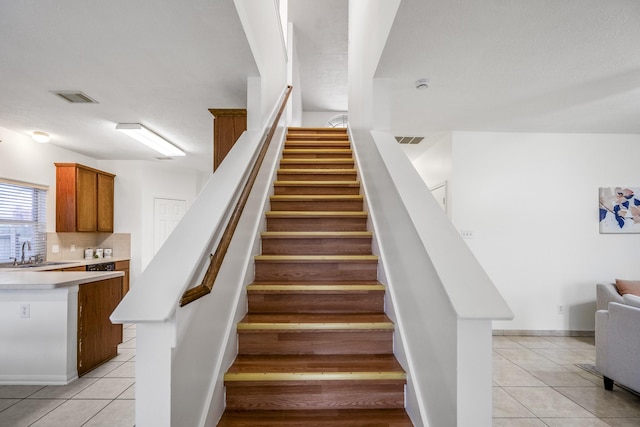 3102 Spring Flower Ln, Spring, TX 77388 - stairway with tile patterned flooring