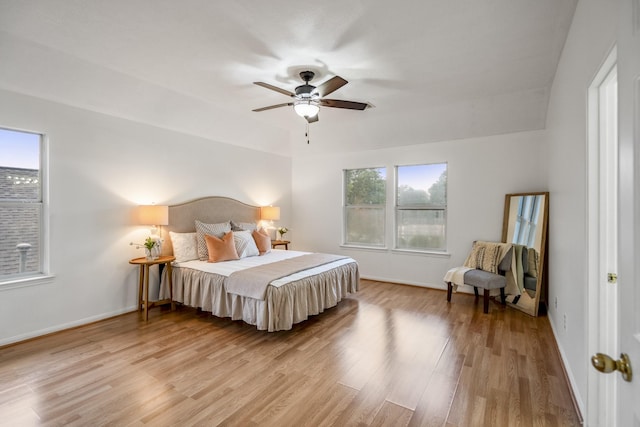 3102 Spring Flower Ln, Spring, TX 77388 - bedroom with light wood finished floors, baseboards, and a ceiling fan