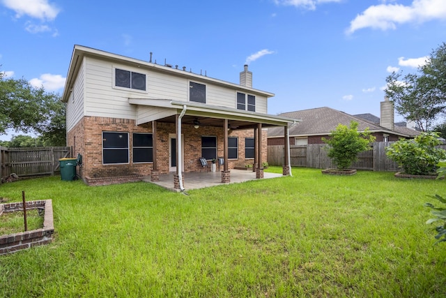 3102 Spring Flower Ln, Spring, TX 77388 - rear view of house with a patio area, brick siding, a chimney, and a ceiling fan