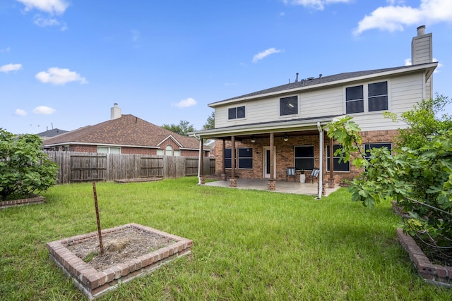 3102 Spring Flower Ln, Spring, TX 77388 - rear view of property with a patio area, brick siding, and a chimney