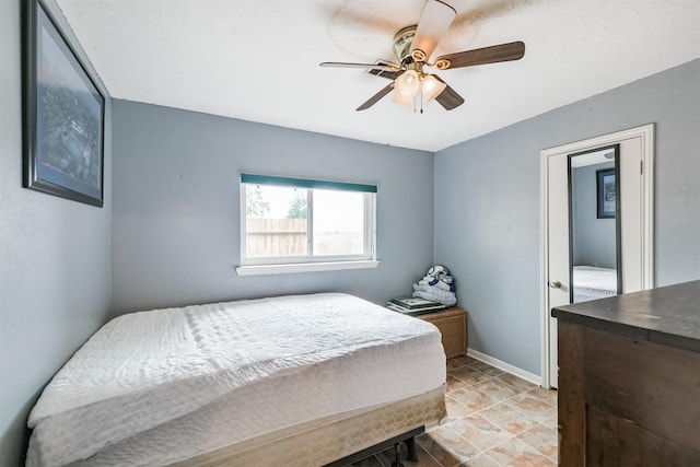 12206 Tawakom Dr, Tomball, TX 77375 - bedroom with a ceiling fan and baseboards