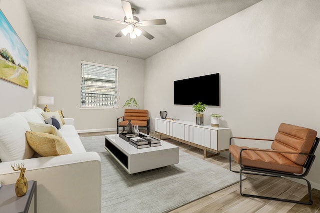 24743 Levante Dr, Richmond, TX 77406 - living area with wood finished floors, ceiling fan, and baseboards