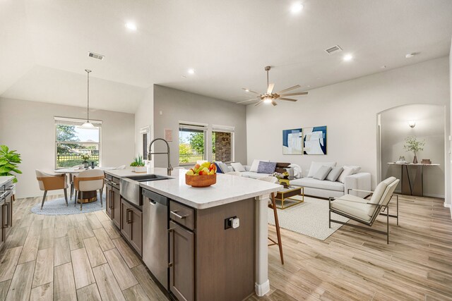 24743 Levante Dr, Richmond, TX 77406 - kitchen featuring a sink, dishwasher, light wood-style floors, light countertops, and a ceiling fan