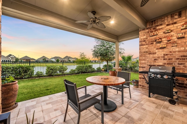 24743 Levante Dr, Richmond, TX 77406 - view of patio / terrace with ceiling fan, grilling area, and a water view