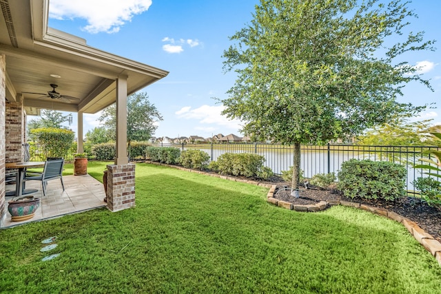 24743 Levante Dr, Richmond, TX 77406 - view of yard featuring a ceiling fan, a water view, and a patio area