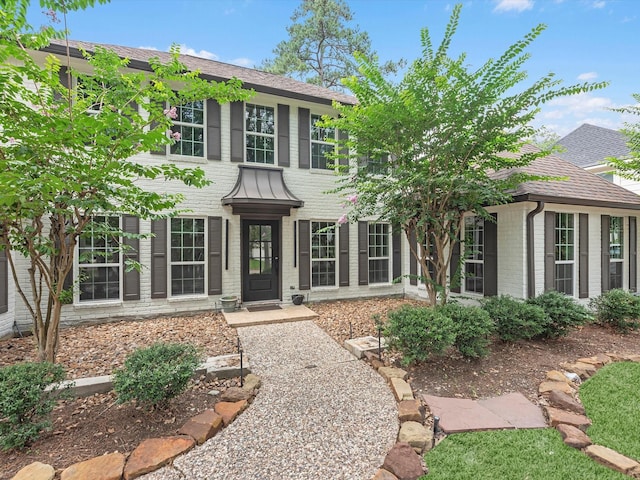 9414 Stockport Dr, Spring, TX 77379 - colonial home featuring brick siding and a shingled roof