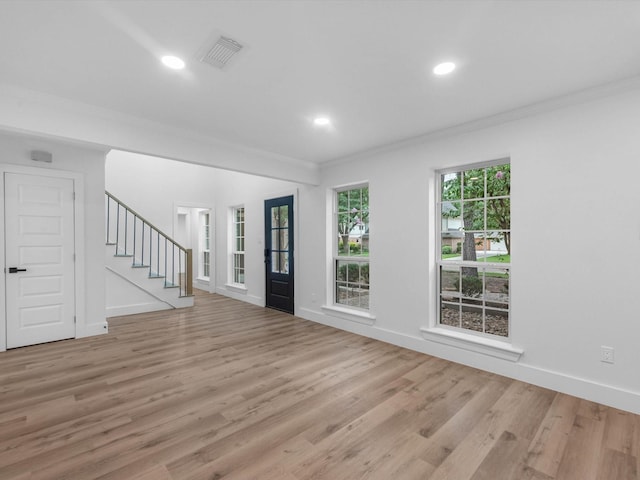 9414 Stockport Dr, Spring, TX 77379 - entryway with crown molding, light wood-type flooring, stairs, recessed lighting, and baseboards