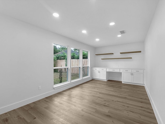 9414 Stockport Dr, Spring, TX 77379 - unfurnished living room featuring wood finished floors, baseboards, and recessed lighting