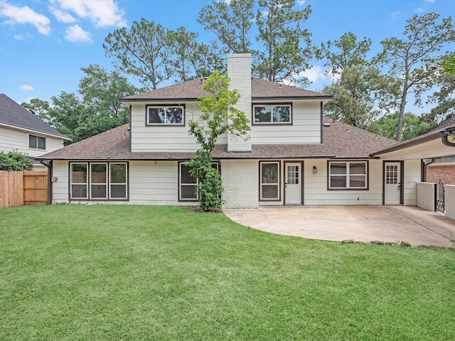 9414 Stockport Dr, Spring, TX 77379 - rear view of house featuring roof with shingles, a chimney, and a patio area