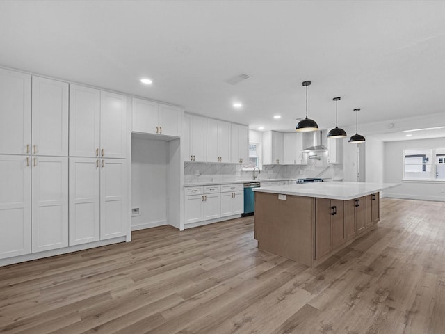 9414 Stockport Dr, Spring, TX 77379 - kitchen with stainless steel appliances, white cabinets, light countertops, plenty of natural light, and recessed lighting