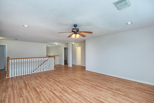 4126 Winesap Bend Dr, Stafford, TX 77477 - unfurnished room with light wood-type flooring, ceiling fan, baseboards, and recessed lighting