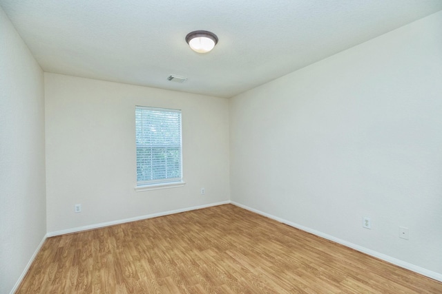 4126 Winesap Bend Dr, Stafford, TX 77477 - spare room with light wood-style floors and baseboards