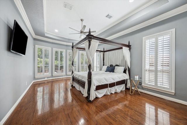 22719 Arbor Stream Dr, Katy, TX 77450 - bedroom featuring wood finished floors, baseboards, ornamental molding, a raised ceiling, and recessed lighting