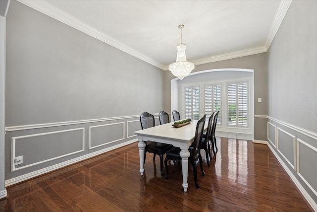 22719 Arbor Stream Dr, Katy, TX 77450 - dining space featuring ornamental molding, a chandelier, a decorative wall, wood finished floors, and wainscoting