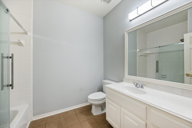 22719 Arbor Stream Dr, Katy, TX 77450 - bathroom with toilet, vanity, tile patterned flooring, baseboards, and enclosed tub / shower combo