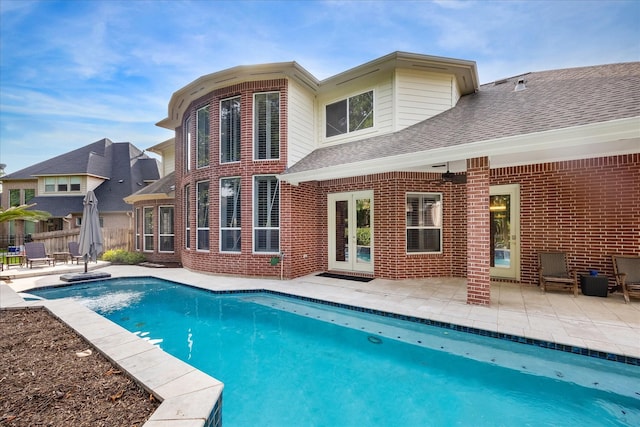22719 Arbor Stream Dr, Katy, TX 77450 - back of house with roof with shingles, a patio, and brick siding