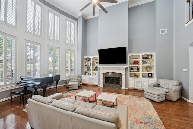 22719 Arbor Stream Dr, Katy, TX 77450 - living area featuring a high ceiling, ceiling fan, a premium fireplace, plenty of natural light, and baseboards