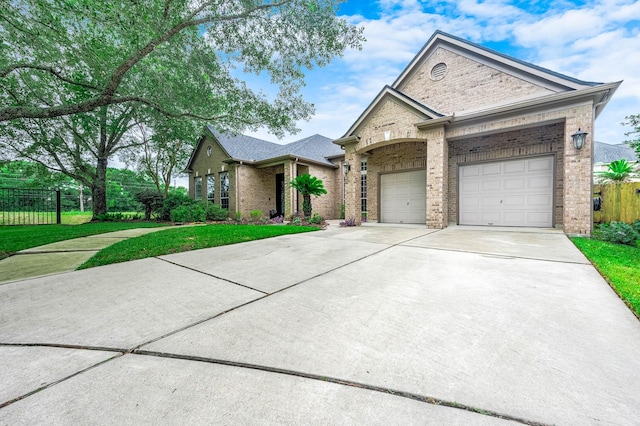 4322 Cannondale Ln, Katy, TX 77450 - view of front of house with brick siding, concrete driveway, and an attached garage