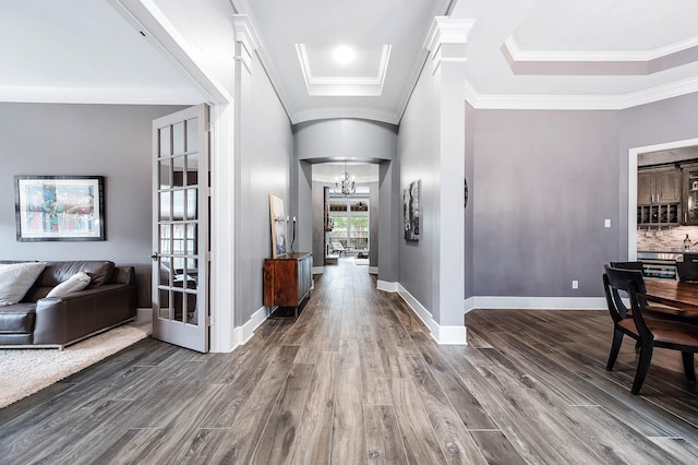 4322 Cannondale Ln, Katy, TX 77450 - foyer with dark wood finished floors, a chandelier, ornamental molding, and baseboards