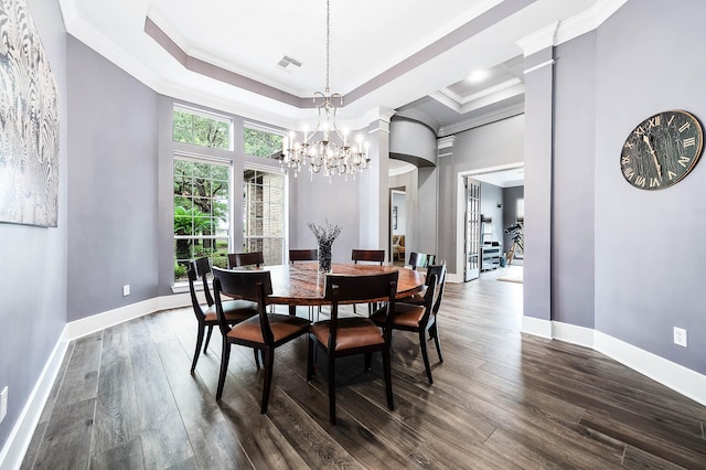 4322 Cannondale Ln, Katy, TX 77450 - dining area featuring a chandelier, crown molding, dark wood-style flooring, baseboards, and a towering ceiling