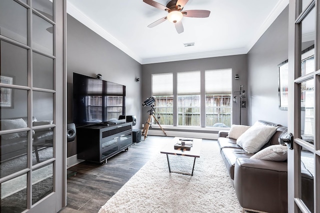 4322 Cannondale Ln, Katy, TX 77450 - living room featuring healthy amount of natural light, crown molding, dark wood-style floors, ceiling fan, and a baseboard radiator