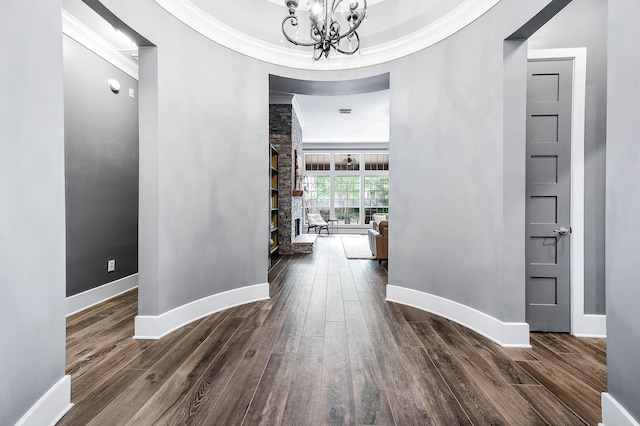 4322 Cannondale Ln, Katy, TX 77450 - corridor with ornamental molding, wood finished floors, baseboards, and a chandelier
