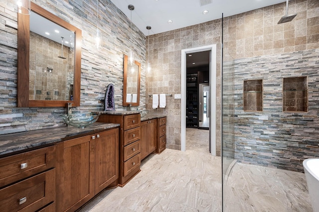 4322 Cannondale Ln, Katy, TX 77450 - full bathroom with double vanity, a walk in shower, tile walls, a freestanding bath, and marble finish flooring